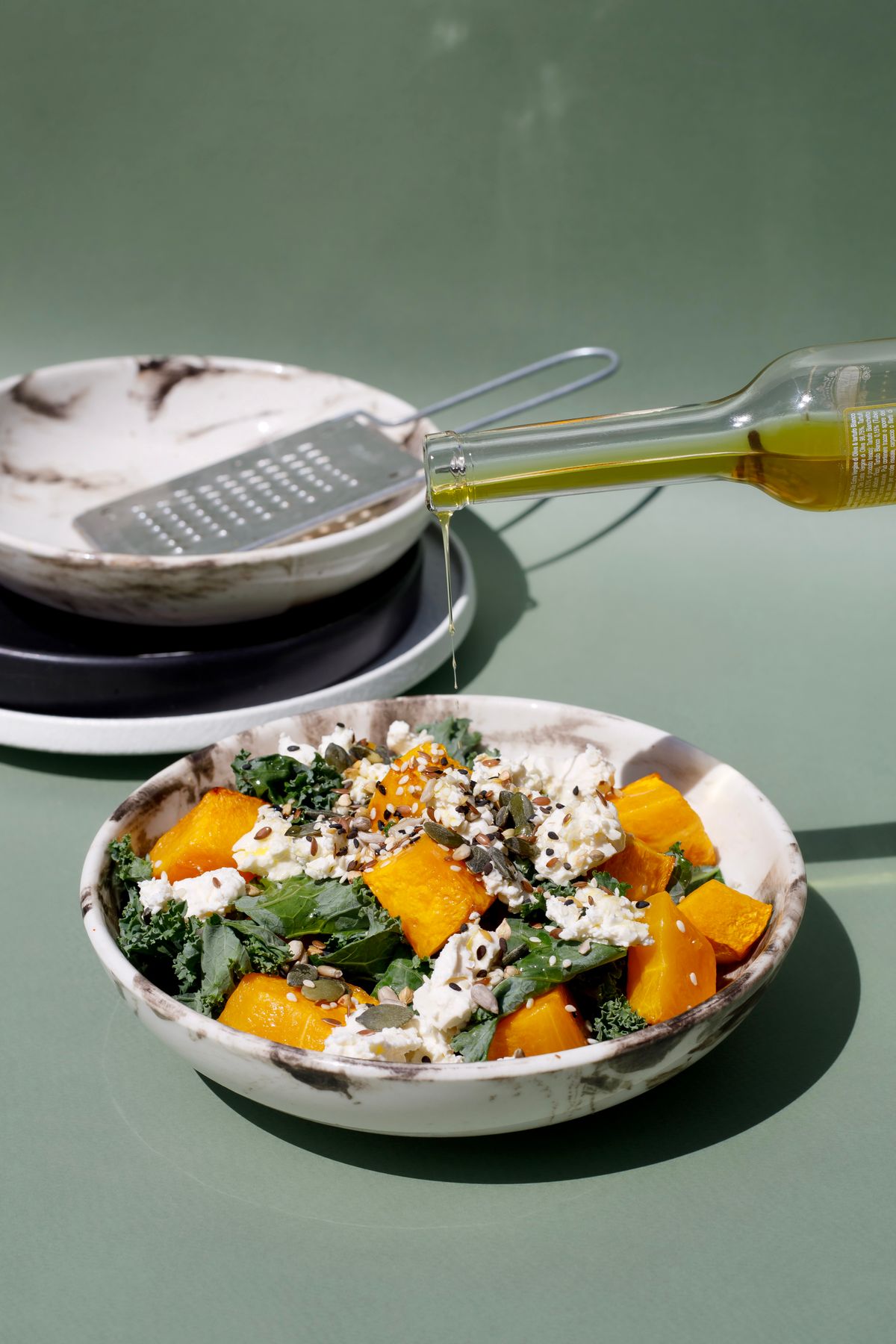 A salad with roasted pumpkin, leaves and cheese