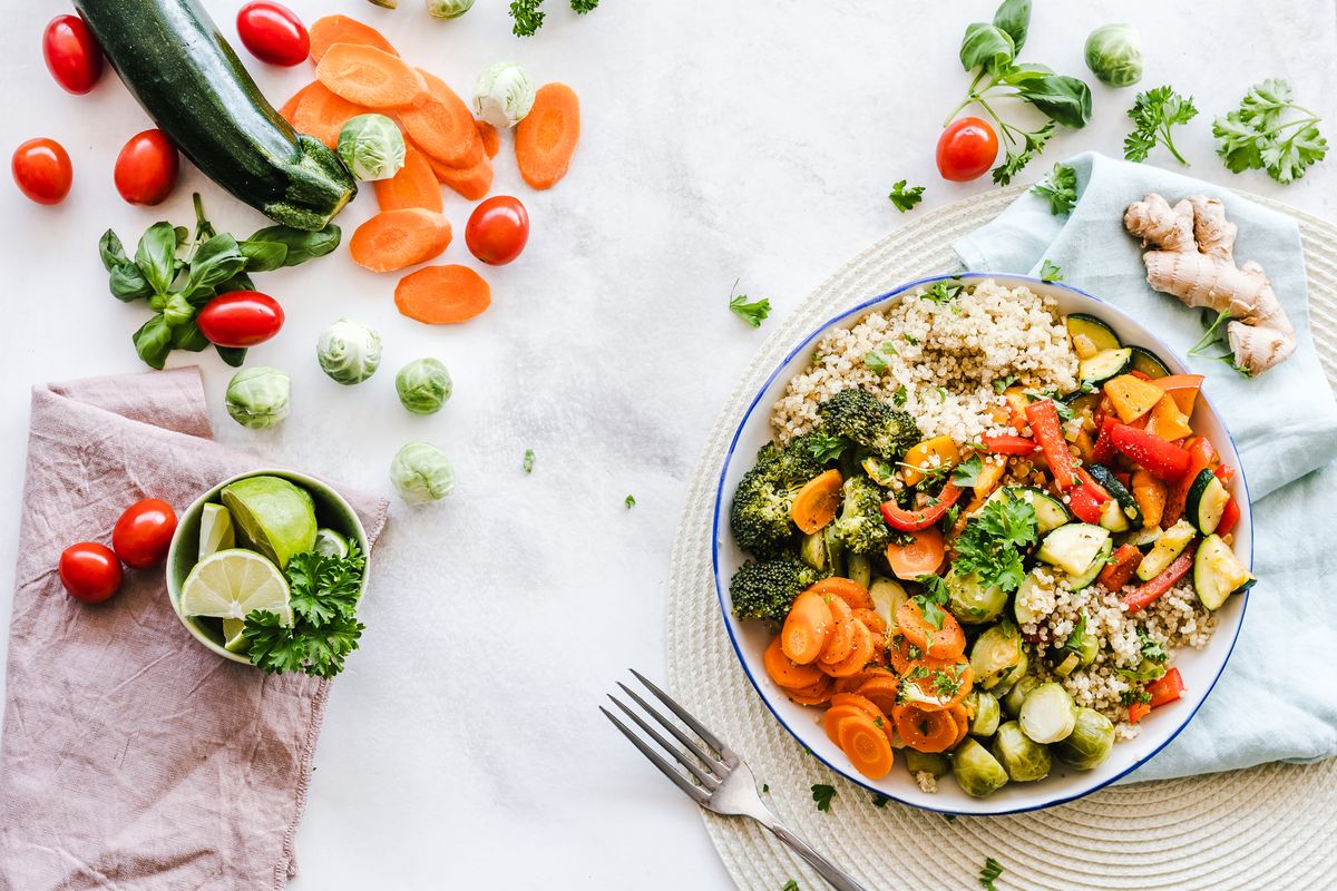 A vegetable and grain bowl with carrots