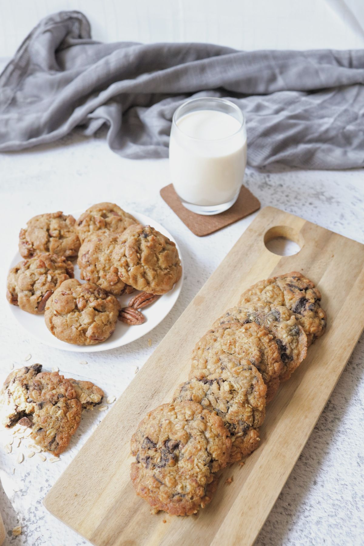 Oat-style cookies beside a glass of milk; illustrative baking photograph