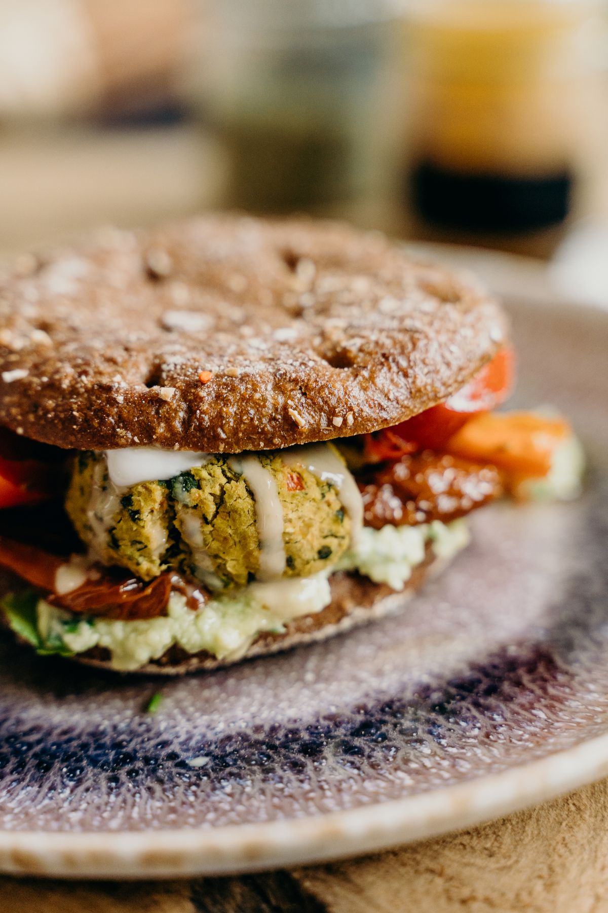 A plant-based falafel burger; illustrative serving style