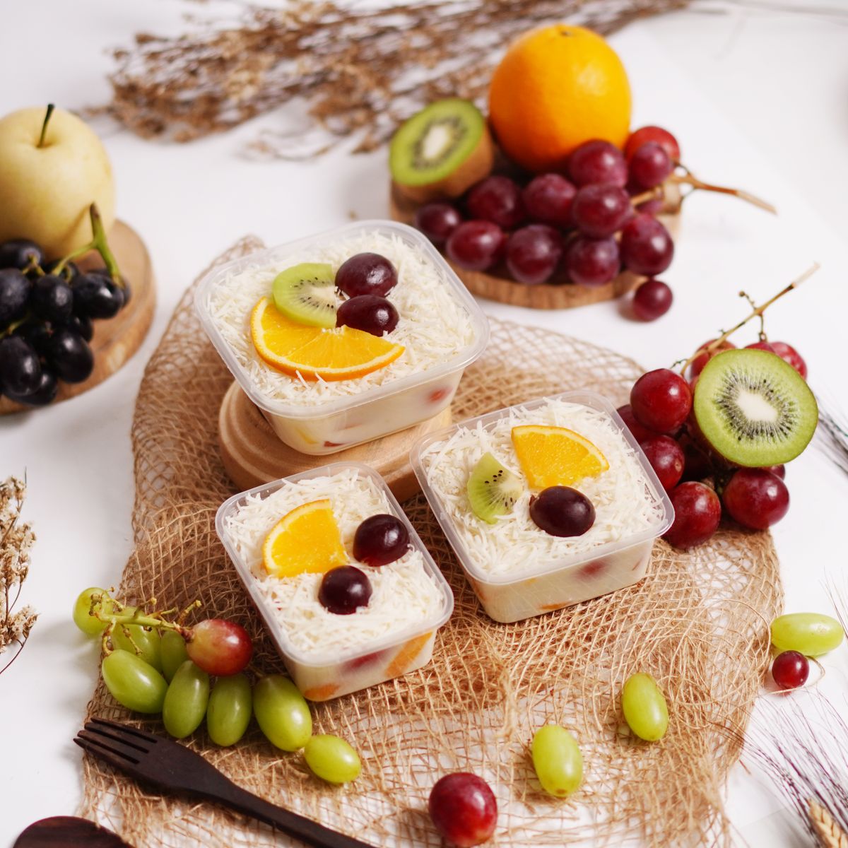Fruit portions with kiwi, grapes and orange