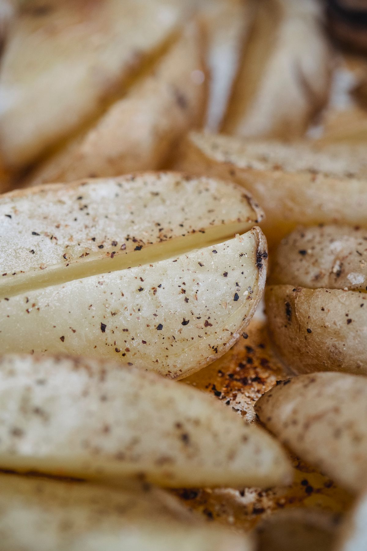 Seasoned potato wedges, illustrating the roasting style